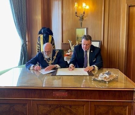 Halifax Mayor, Mike Savage and the Lord Mayor of Portsmouth, Councillor Hugh Mason signing the agreement